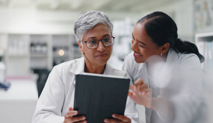 Science research and team of women with tablet for medical study results.png